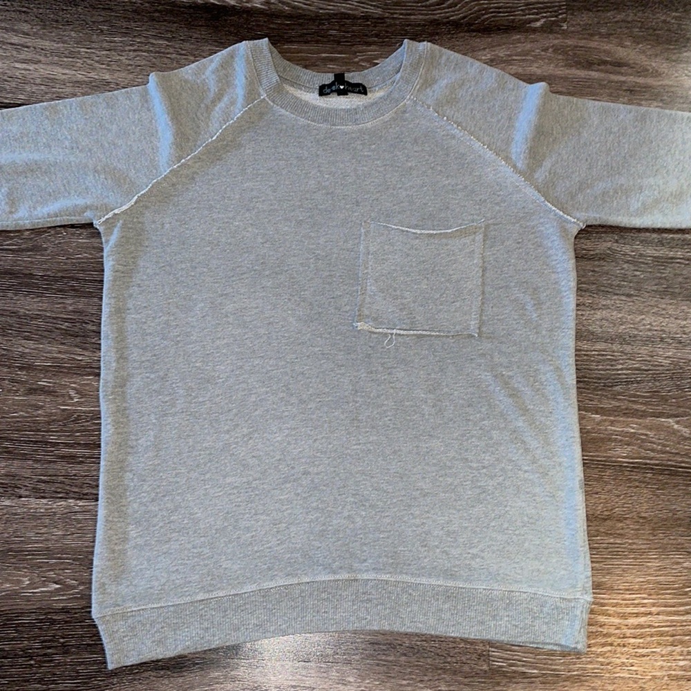 Unfinished and oversized gray sweatshirt